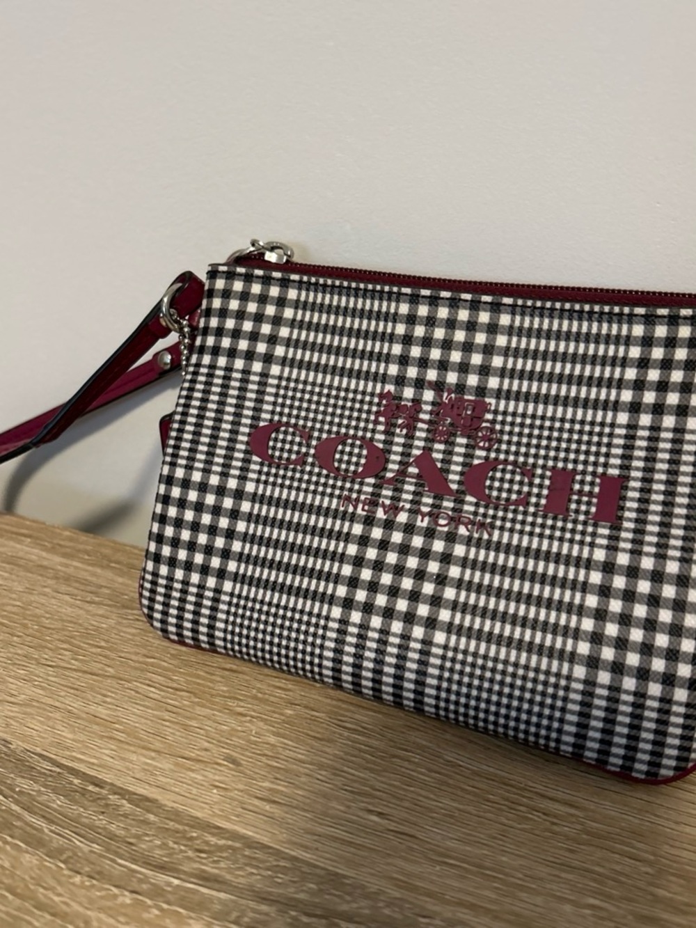 Coach Black & White Plaid Wristlet with Maroon Trim.